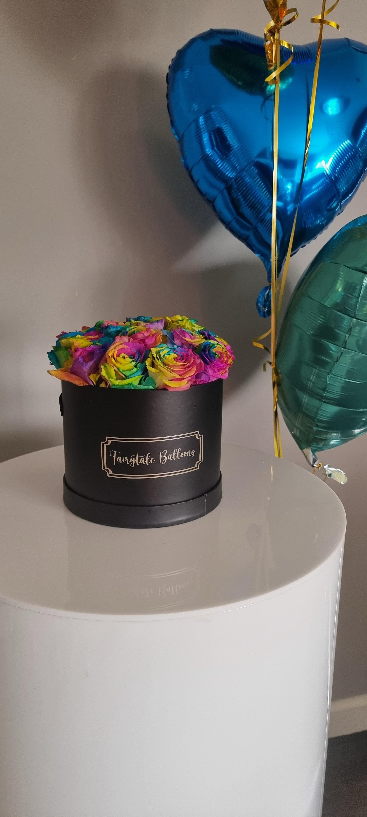 Personalised Black box with roses and balloons sitting on a white plinth
