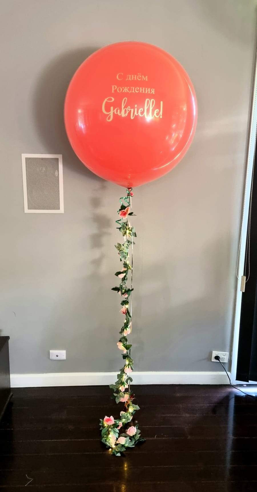 Coral Orange XL Bubble Balloon with an Illuminated Floral Garland Delivered Melbourne