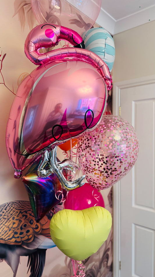 Pink flamingo balloon bouquet with a pink confetti balloon, metallic star and colourful heart balloons delivered by Fairytale Balloons in Richmond, Melbourne