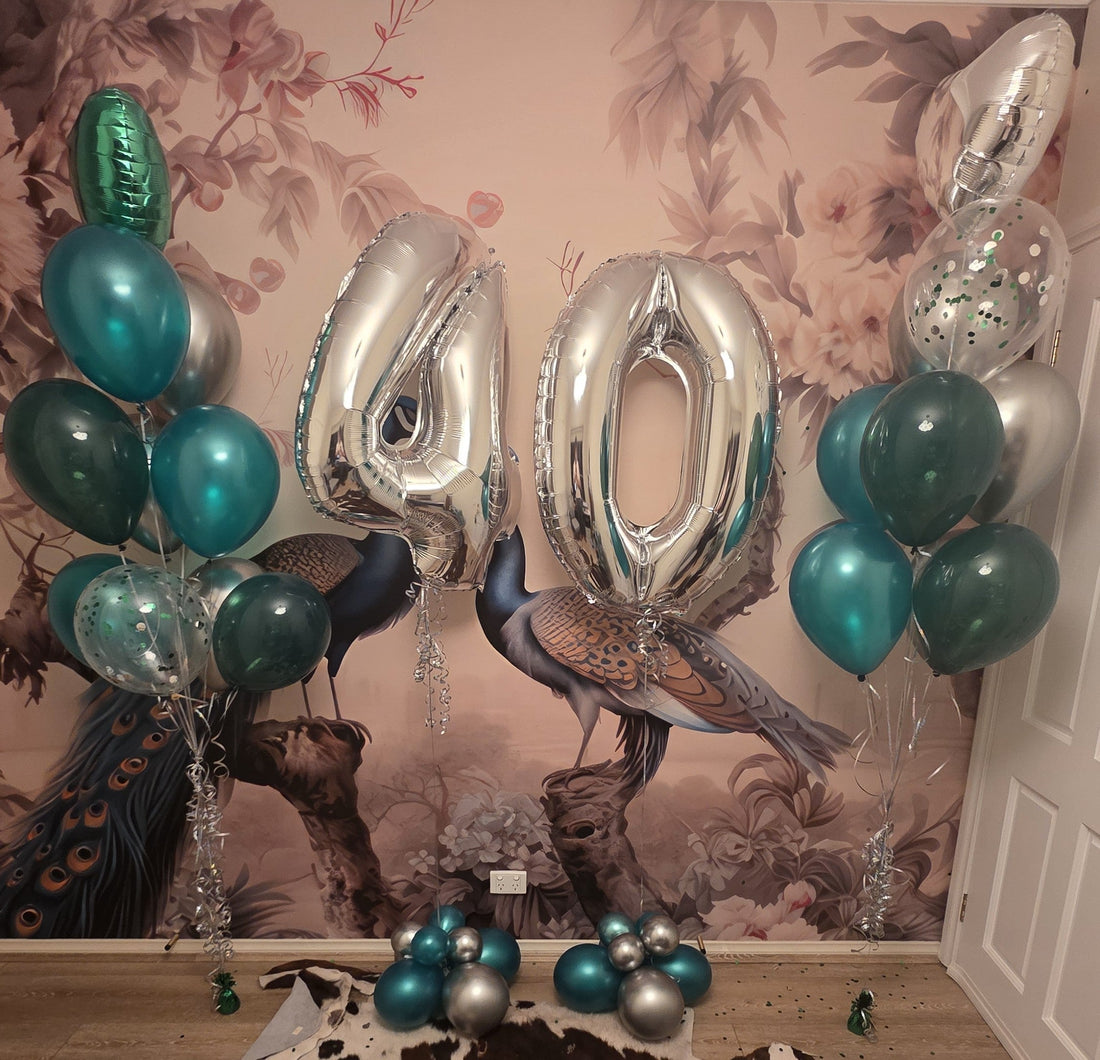 Teal green and silver 40th birthday balloon installation with oversized silver number balloons dual bouquets and floor clusters Cheltenham Melbourne Fairytale Balloons