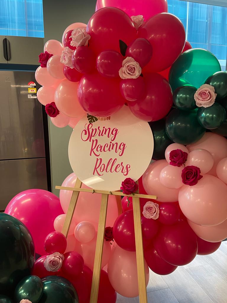 Spring Racing Balloon Garland on an easel with flowers in Southbank Venue