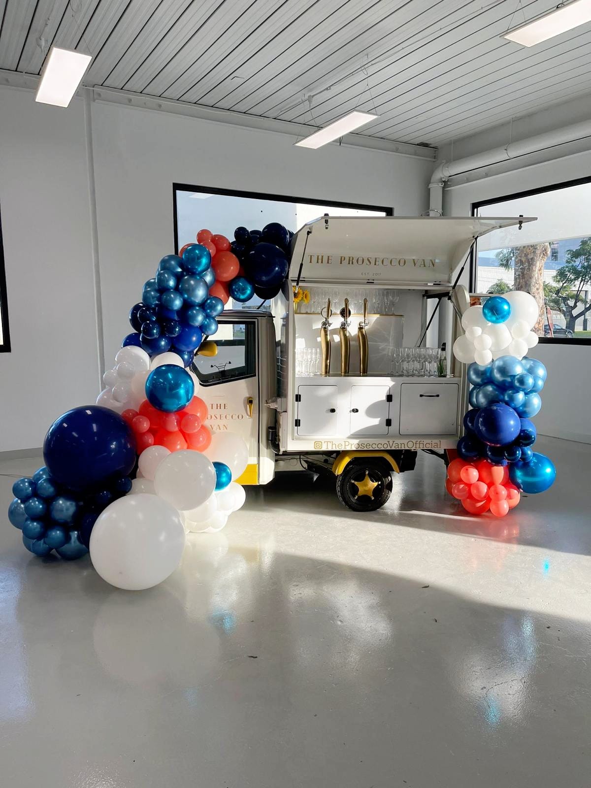 White Blue and Red Prosecco Van Cart Balloon Garland Melbourne Entrance