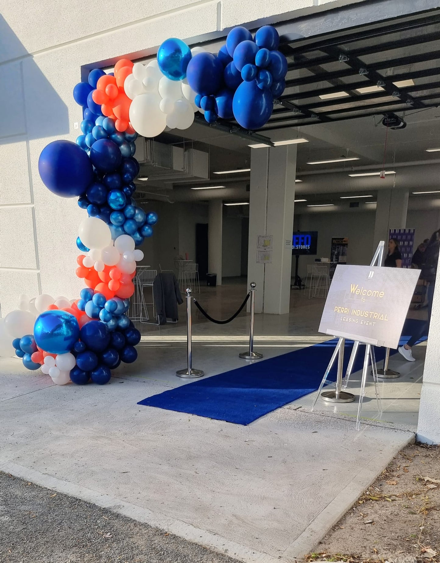 White Blue and Red Prosecco Van Cart Balloon Garland Melbourne Entrance Perri Industrial Leasing Event 